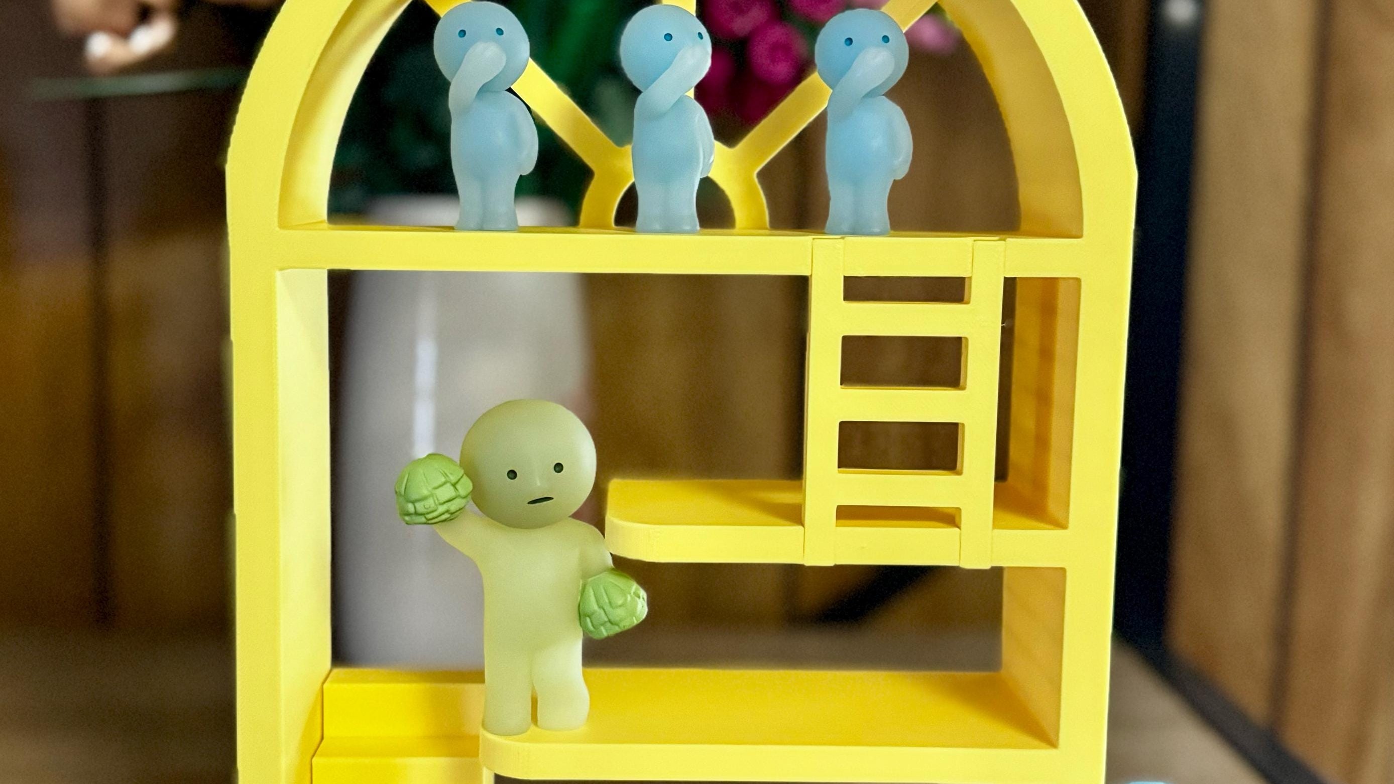 3D printed figures displayed on shelf - collectible showcase